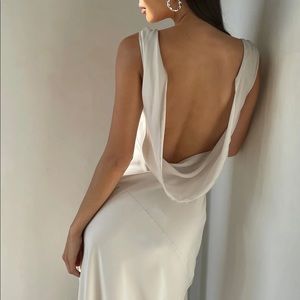 Meshki “Nadia” dress. A maxi satin dress with back cowl in silver.